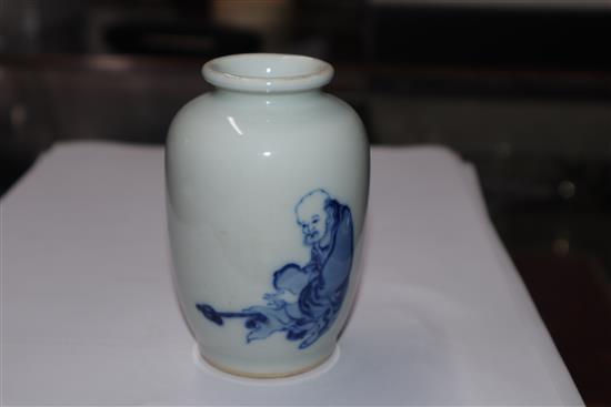 A Chinese small blue and white vase painted with a luohan H.10cm